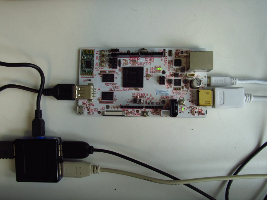 The pcDuino microcomputer. The wires connected are power and HDMI output (right) as well as keyboard, mouse, and TC-1 (via USB hub). The length of the board is about 12cm.